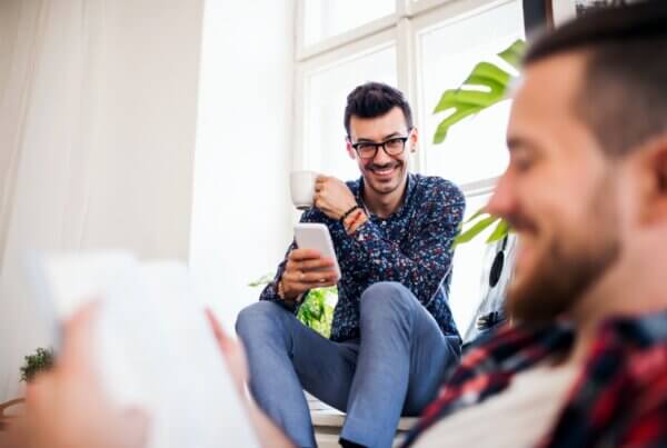 what sets a sober living apart a group of young friends relaxing indoors house