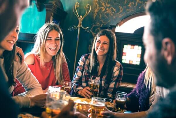 why people drink group of happy friends drinking beer at brewery good to get sober