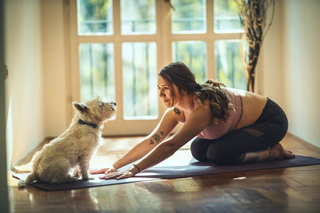 woman with pet dog stay healthy indoors at sober living house Large.jpeg