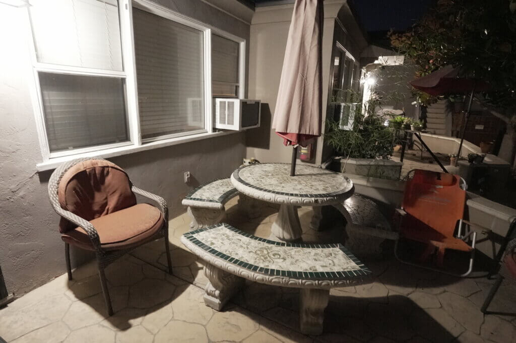 Enjoying the Evening at Pacific Beach Recovery Patio of Pacific Beach Recovery at Night