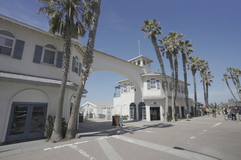 Two sober bikers riding away from the Pacific Beach Pier in San Diego on their way to an AA meeting