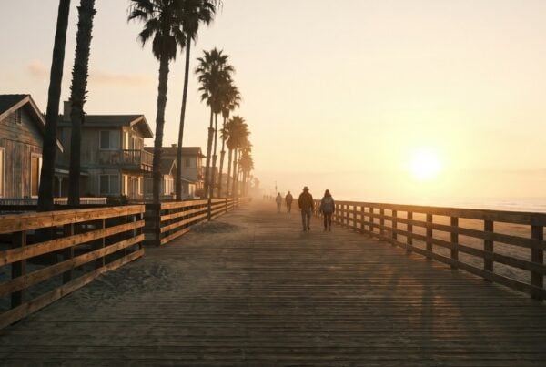 Long Pacific Beach boardwalk at sunrise showing the long road of a sober living stay